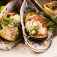 Mussels · New Zealand Green Shell Mussels, steamed to order with our spice blend and drizzled with but...
