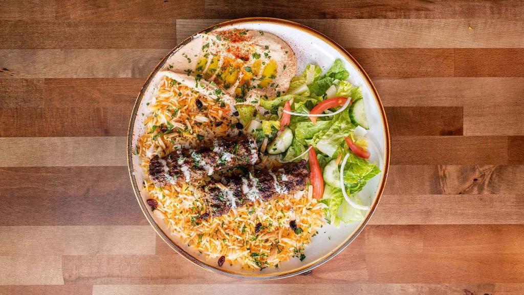 Lamb Kebabs Plate · Grilled ground lamb, seasoned to perfection served with vegetables over rice.