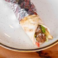 Kabab Sandwich · Grilled ground lamb, seasoned to perfection wrapped in pita bread with lettuce, tomatoes, an...