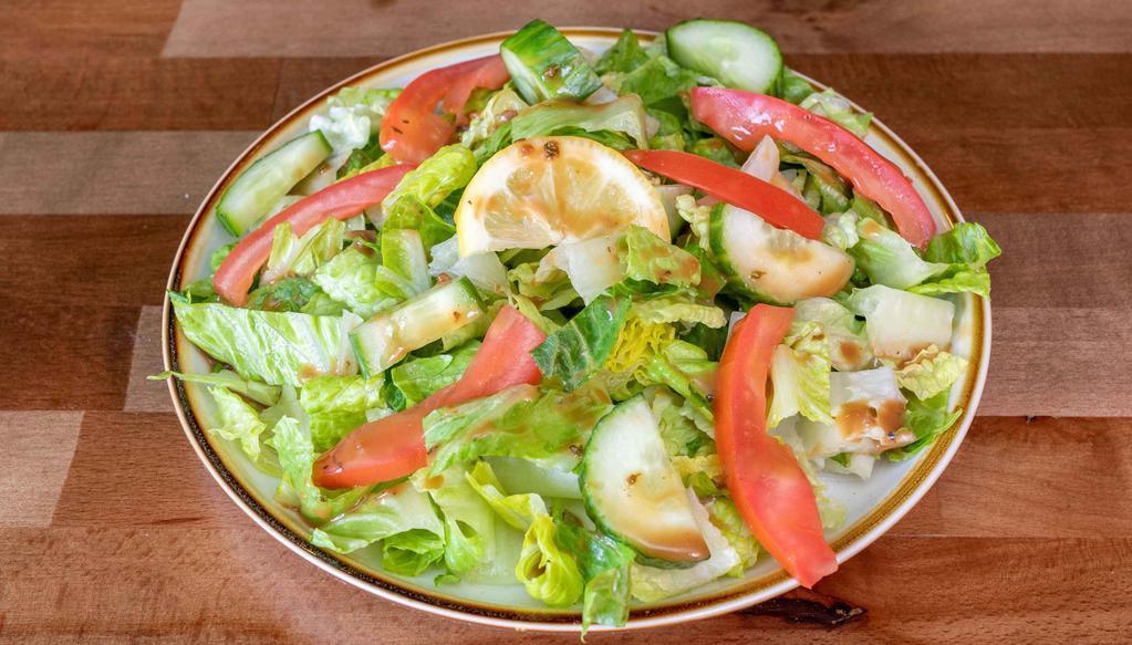 House Salad · Fresh lettuce, tomatoes, and homemade dressing.