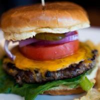 Cheeseburger · Six ounce  beef patty, cheddar, lettuce, red onions, tomatoes, pickles and mayo in brioche bun