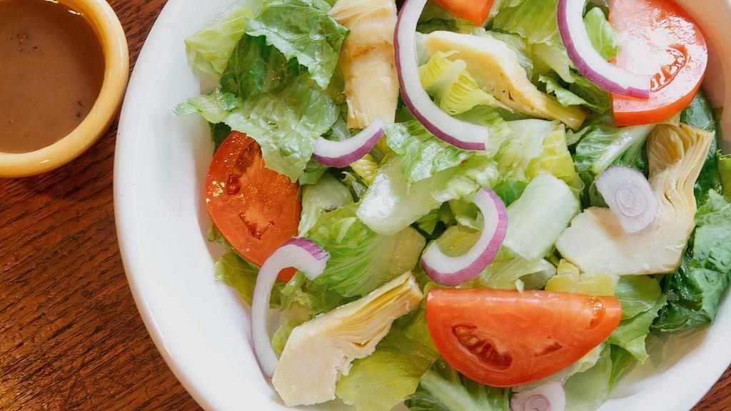 Angelico Salad · Romaine, artichokes, tomatoes and red onions with balsamic dressing.