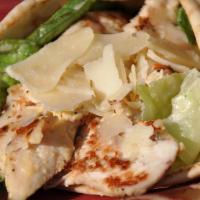 Chicken Caesar Wrap · Grilled chicken breast, mozzarella and Caesar salad wrapped in a warm pita.