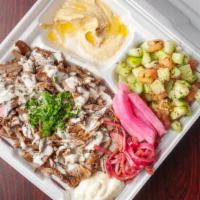 Lamb & Beef Shawarma Plate · Seasoned lamb and beef cooked slowly on a vertical rotisserie and thinly sliced with pickles...