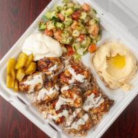 Chicken Kabob Plate · Served with two skewers. Cubes of marinated and seasoned chicken breast skewered together wi...