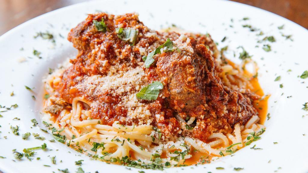 Spaghetti & Meatballs · Tossed in Homemade Marinara Sauce