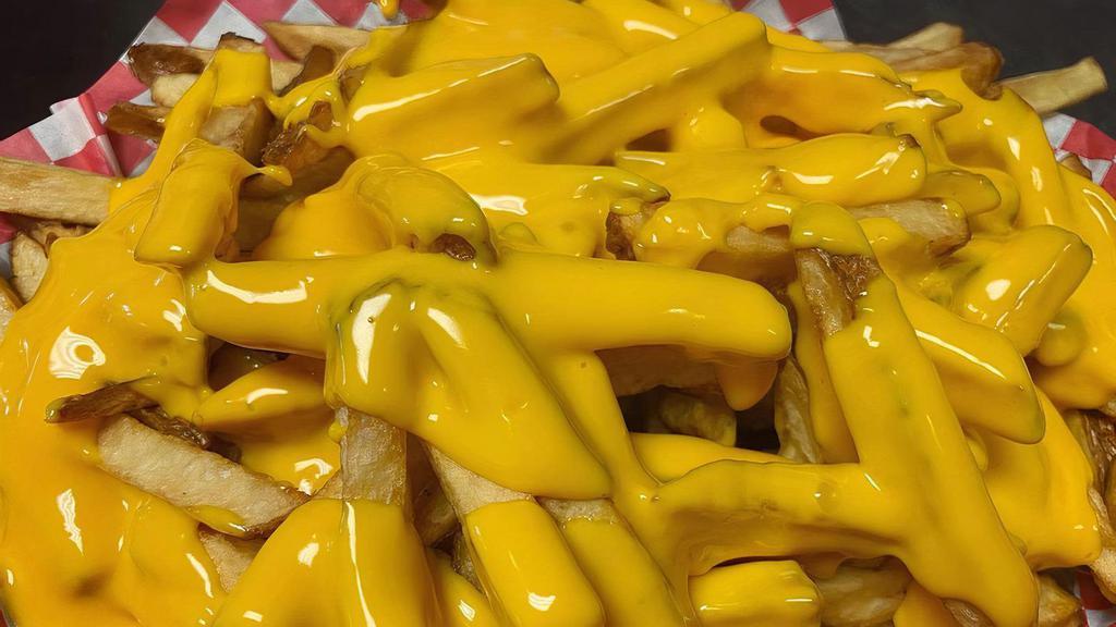Cheese Fries · Fresh cut fries topped with cheese wiz.