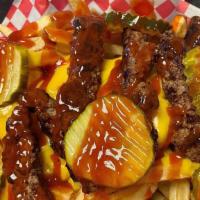 Cheeseburger Fries · Fresh cut french fries topped with Angus beef, Cheese Wiz, ketchup and pickles.