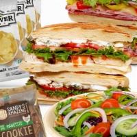Family Panini Pak · FEEDS 4— two large panini sandwiches (served in halves), four plain kettle chips, two chocol...