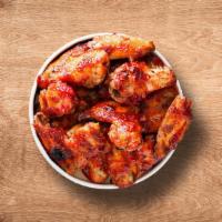 Classic Hot Wings (12 Pcs) · 12 classic bone in traditional wings served in a sauce of choice with a dipping sauce of cho...