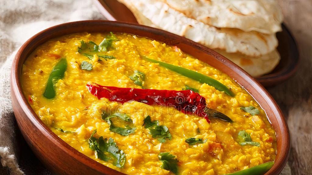Dal Tadka · Vegan, gluten free. Yellow lentil tempered with Indian spices and tomatoes, Indian herbs and spices.