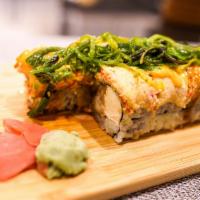 Midori Roll · Shrimp tempura & cream cheese topped with spicy crab,  seaweed salad, spicy mayo & eel sauce.