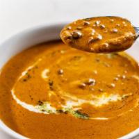 Daal Makhani · Slow cooked black lentils flavored with fresh ginger, garlic and Indian spices.