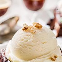 Brownie With Ice Cream · Brownie served with vanilla ice cream.