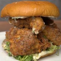 Izzit Chik'N Sandwich  · Fried oyster mushrooms, garlic aioli, house made pickles, lettuce, tomato. on a toasted bun.