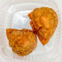 Meat Samosa · Two pieces. Pastry turnovers stuffed with minced lamb.