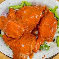 Tandoori Chicken · Tender chicken marinated in a delicately spiced yogurt sauce and grilled on skewers in our t...
