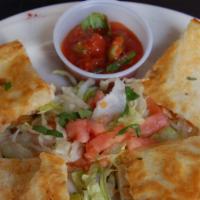 Chicken Quesadillas · Grilled chicken with Cheddar and Monterey Jack cheese in a flour tortilla, served with a sid...