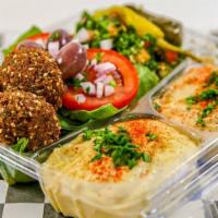 Veggie Combo Platter · Three falafel balls, hummos, Baba ghanouj, tabouly, spinach salad, stuffed grape leaves, and...