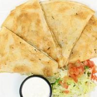 Steak Quesadilla · Served with sides of sour cream and salsa.