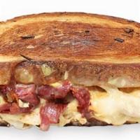 Grilled Reuben · Corned beef, russian dressing, coleslaw & provolone cheese on grilled rye.