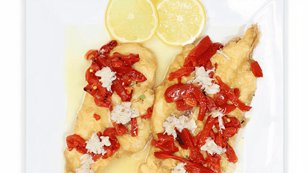 Chicken Alla Mia · Sauteed chicken breast with roasted peppers & crab meat in a lemon butter white wine sauce.