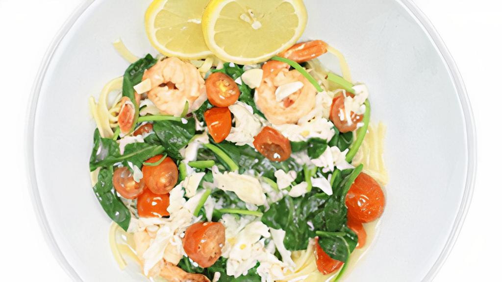 Shrimp Marino · Sautéed jumbo shrimp with spinach, tomato & crab meat in a white wine sauce.