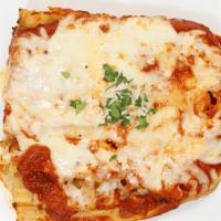 Lasagna · Layers of noodles, ground beef & ricotta cheese, topped with sauce and mozzarella cheese.