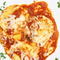 Baked Ravioli · Cheese ravioli with tomato sauce & mozzarella cheese.