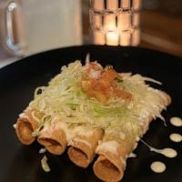 Cheese Flautas · Vegetarian. Crispy corn tortillas filled with Oaxaca cheese, topped with lettuce, pico de ga...