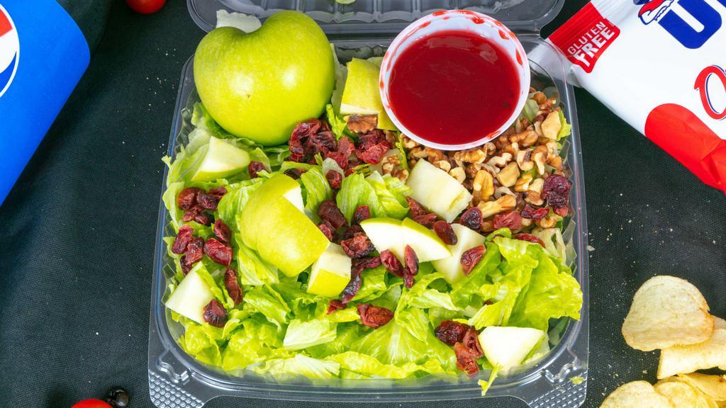 Apple Walnut Salad · Romaine lettuce, walnuts, feta cheese, dried cranberries and raspberry vinaigrette.