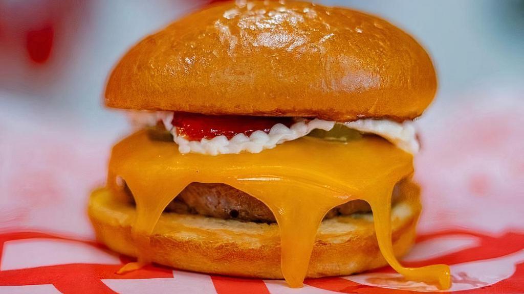 Cheeseburger · 1/3 Lb patty, cheedar cheese, pickles, ketchup and mustard.