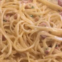 Spaghetti Carbonara · pancetta, egg, pecorino romano & a touch of cream