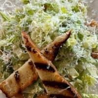 Caesar Salad · romaine hearts, parmesan crisp, garlic croutons, crispy shallots, classic dressing.