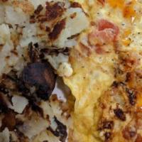 Greek Omelette · With tomatoes, onions, and feta cheese. Made with three eggs.