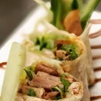 Fuji Duck Roll (Ap) · Grilled duck meat, vegetables and basil wrapped in tortilla with miso sauce.