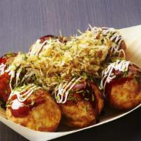 Takoyaki (Ap) · Lightly battered, diced baby octopus, tempura scraps, pickled ginger and green onion, topped...