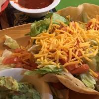 Traditional Taco Salad · A crispy flour our shell stuffed with shredded chicken, ground beef or shredded beef, iceber...