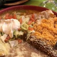 Casa Vallarta Enchiladas · Three enchiladas (one) chicken topped with mole sauce, (one) cheese, and onions topped with ...