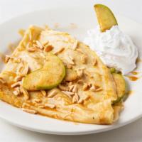 Apple Pie A La Mode · Granny Smith apples, cinnamon, toasted almonds, topped with caramel glaze and whipped cream.