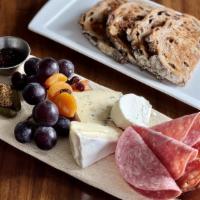 Charcuterie & Cheese Plate · Selection of French Cheese and Meats with Walnut Raisin Bread.