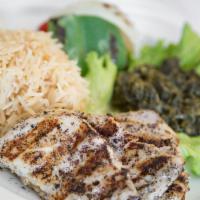 Mourgh Kabob · Char-boiled marinated chicken breast served with sautéed spinach and pallow rice..