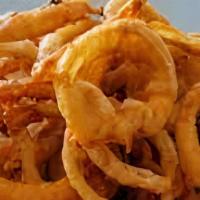 Put A Ring On It · (Vegetarian) Sliced onions dipped in a light batter and fried until crispy and golden brown.