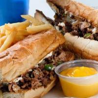 Philly Cheese Steak With Fries And Soda · With fried onion, green pepper, salt, pepper, and mayo.