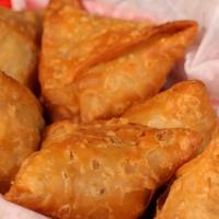 Samosas (2) · Vegan. A savory pastry shell filled with peas and potatoes and choice of chutney.