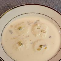 Ras Malai · Gluten-free. Milk cultured patties in cardamom milk with pistachios and nuts.