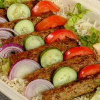 Chicken Kebabs · Ground chicken grilled with onions, cilantro
and spices.
