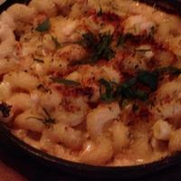 Crab Mac & Cheese · Rich and creamy mac and cheese filled with super lump crab meat and topped with gratin.