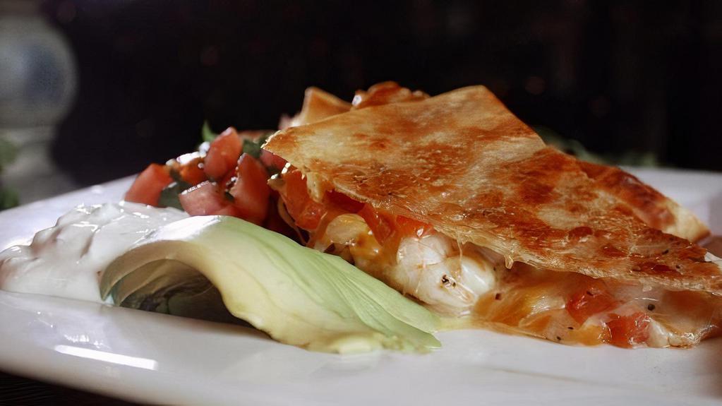Cru Quesadilla · Flour tortilla stuffed with roasted corn, peppers, onions, sharp Cheddar cheese with shrimp, chicken or steak.