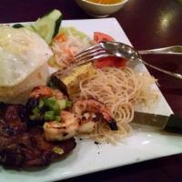 Com Tam Dac Biet · Broked rice combo with pork chop or boneless pork and shredded pork, grilled shrimp, crab ca...